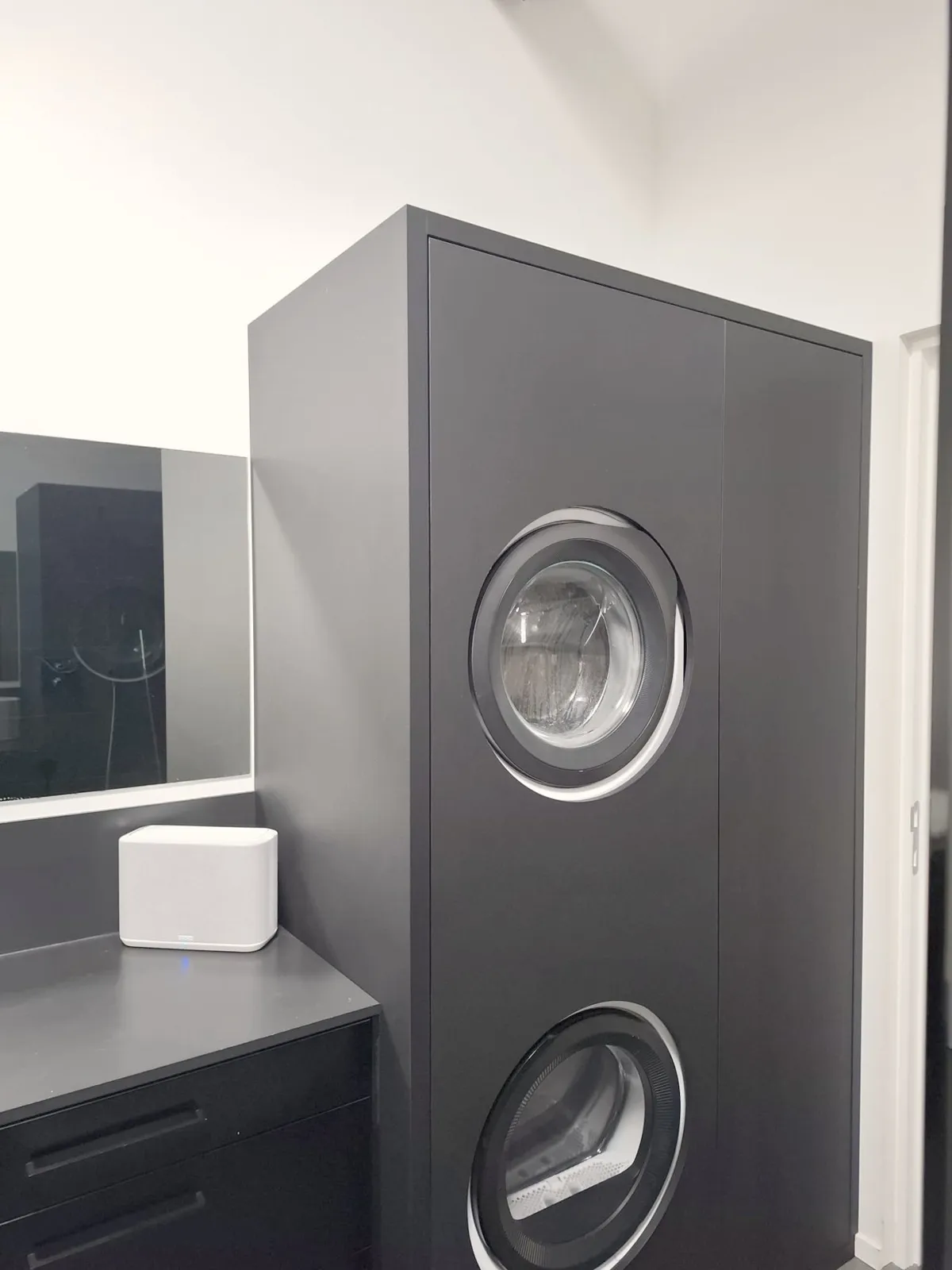 Denon speaker in the black bathroom